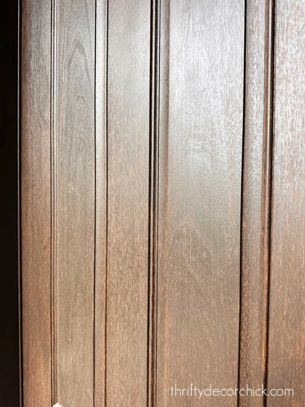faded stained wood door